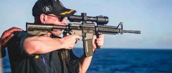 During a training exercise, an American naval officer fired at a target with a telescopic sight mounted backwards.