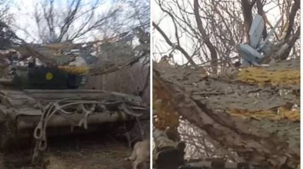 Появились кадры двух российских БПЛА «Ланцет», якобы застрявших в маскировочной сетке над танком ВСУ