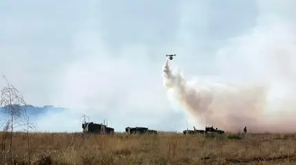 The use of drones by the US military to lay aerosol smoke screens is shown.