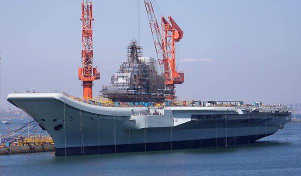 Hangarfartyget "Varyag" kan ansluta sig till den kinesiska flottan under namnet Liaoning