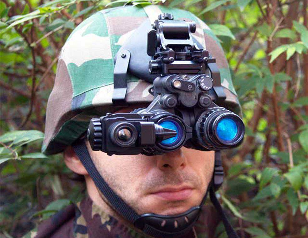 A soldier with standard night vision goggles, to which a Thermoteknix ClipI...