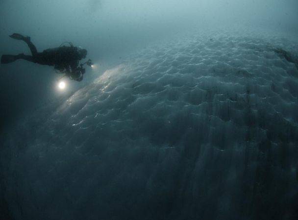 Russian experts test the apparatus that provides breathing diver at a water temperature up to minus 4 degrees Celsius