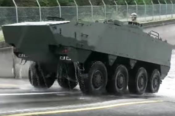 In Japan, demonstrated an improved armored personnel carrier to "protect the islands"