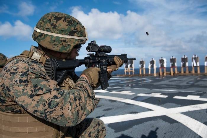 US marines armed with German machine guns