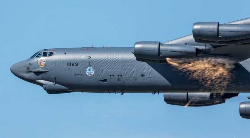 Strategic bomber B-52H with "rain" sparks fell on the photo