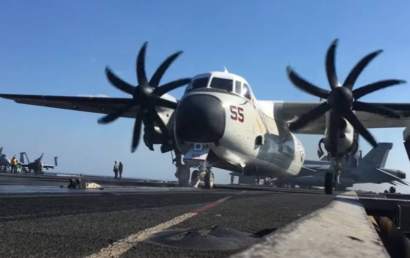 Preparation and takeoff of a C-2 Greyhound turboprop aircraft from the deck of a US Navy aircraft carrier using a catapult